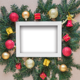Photo frame among fir twigs and christmas balls